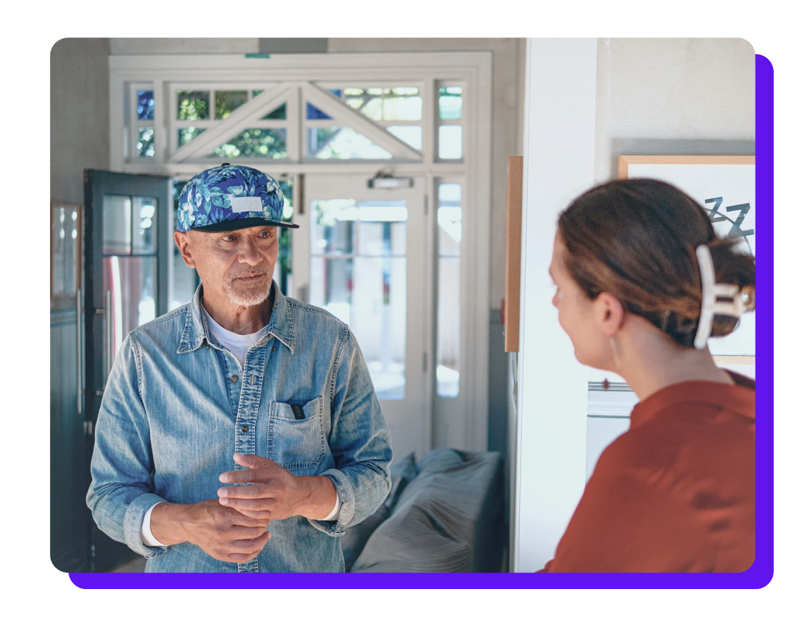 Two people in the charity sector speaking to one another
